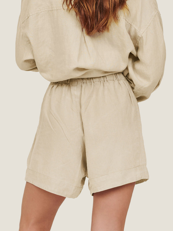 linen shorts in sand