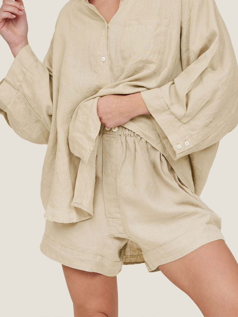 linen shorts in sand